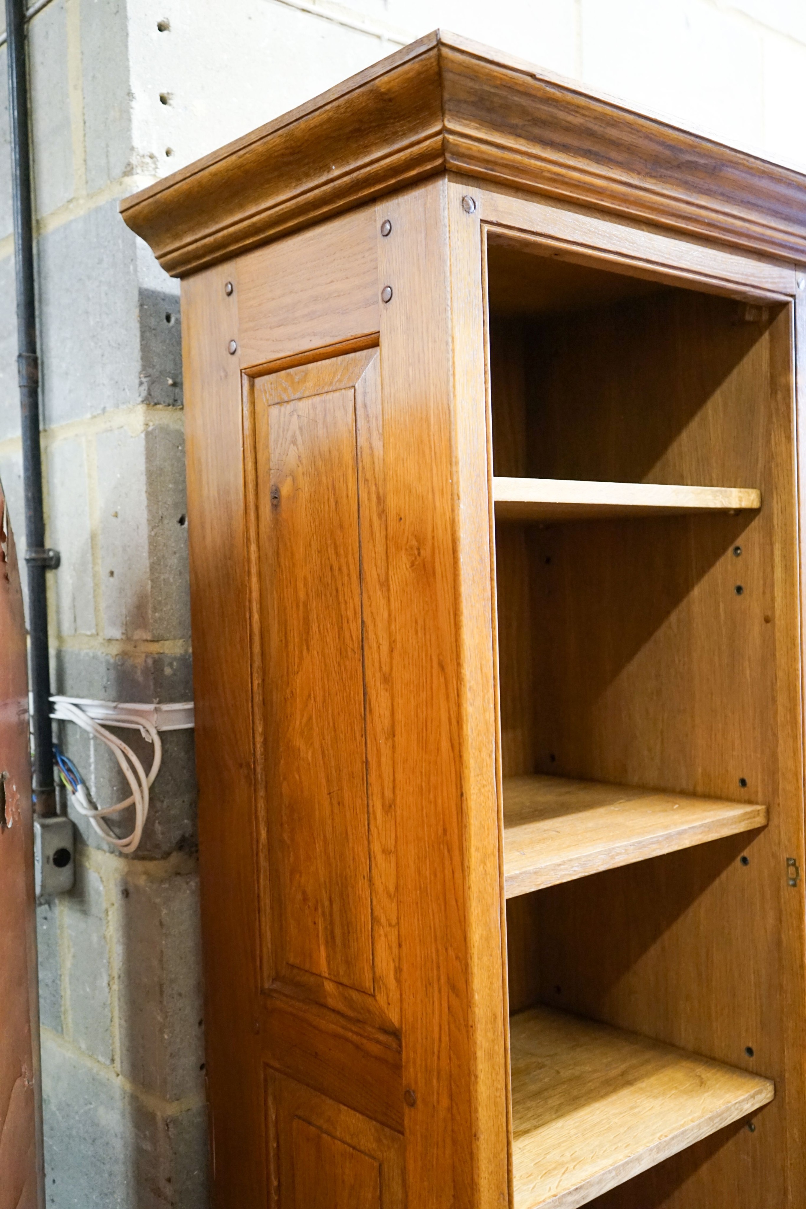 A large reproduction oak dresser with wine bottle storage, length 244cm, depth 60cm, height 201cm